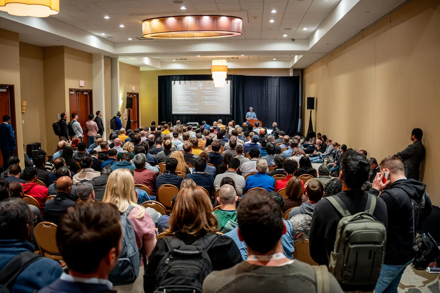 A full training room of professionals during a workshop at All Things AI 2026